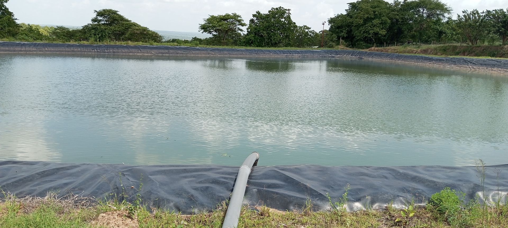 Lined dam after filling with water